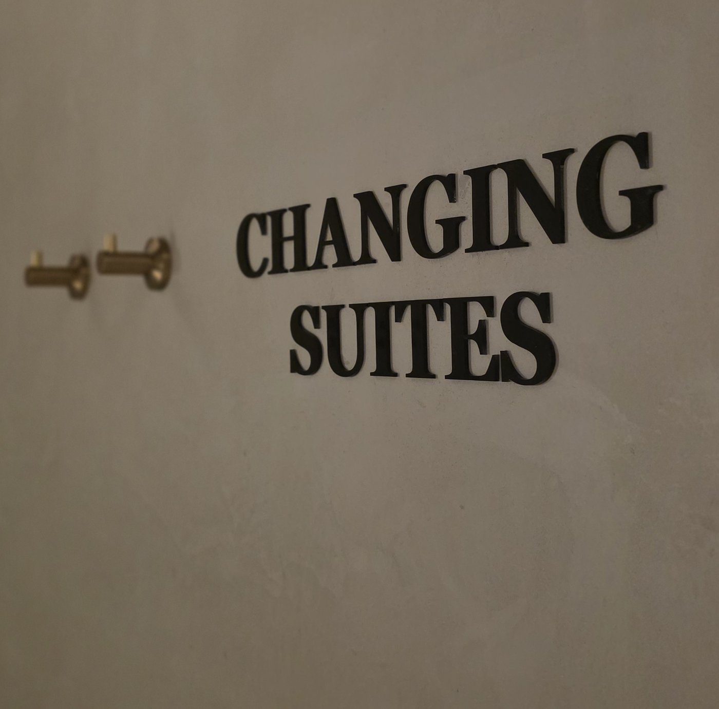 Acrylic Door Lettering — Changing Suites